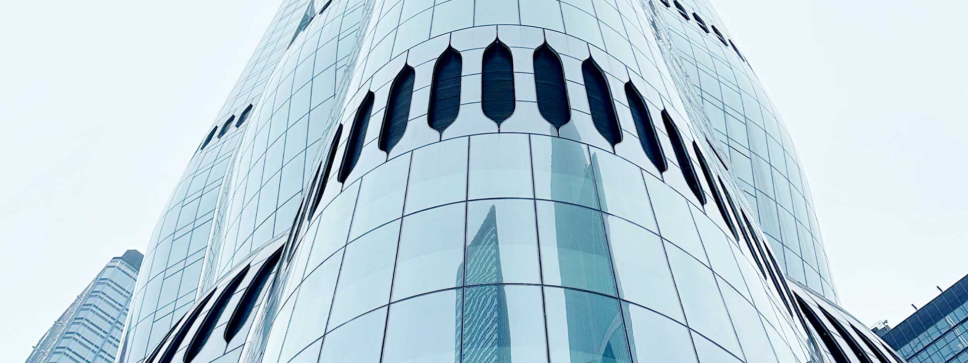 Curved facade glass of The Henderson. ©sedak